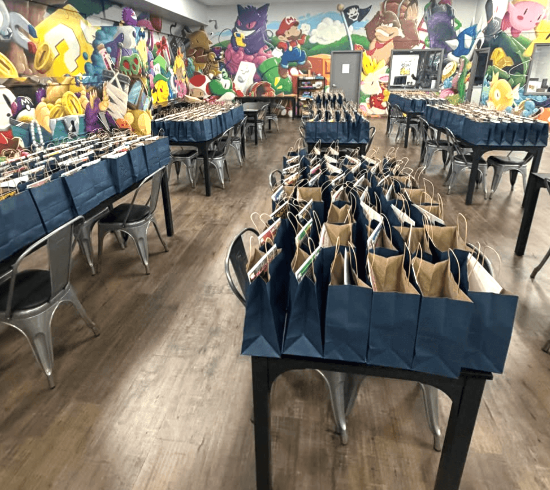 Rows of goodie bags set up for the monthly card show at Collector's Cove